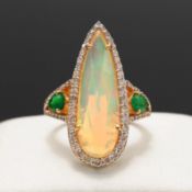 A 14CT YELLOW GOLD OPAL AND DIAMOND DRESS RING.