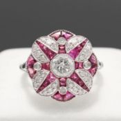 A PLATINUM ART DECO STYLE RUBY AND DIAMOND TARGET RING.