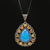 AN OPAL AND DIAMOND PENDANT NECKLACE.