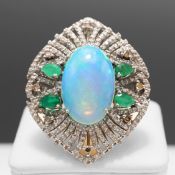 AN OPAL, EMERALD AND DIAMOND DRESS RING.