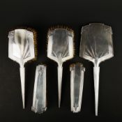AN ART DECO SILVER BACKED DRESSING TABLE SET.
