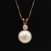 A 9CT GOLD CULTURED PEARL AND DIAMOND NECKLACE.