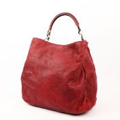 YVES SAINT LAURENT. ROADY BAG.