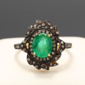 AN EMERALD AND DIAMOND PARCEL-GILT SILVER DRESS RING.