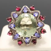 A MULTI GEMSTONE SET SILVER DRESS RING.