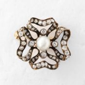 A YELLOW METAL DIAMOND AND PEARL RIBBON BROOCH.