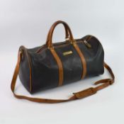 AN ESCADA CANVAS AND LEATHER HOLDALL.