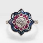 A PLATINUM DIAMOND, RUBY AND SAPPHIRE RING.