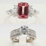 AN 18CT WHITE GOLD PINK SAPPHIRE AND WHITE STONE DRESS RING.