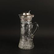 A TIFFANY & CO SILVER MOUNTED CUT GLASS WATER PITCHER.