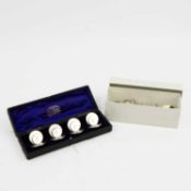 A SET OF SILVER MENU HOLDERS.