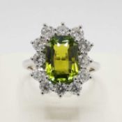 AN 18CT WHITE GOLD TOURMALINE AND DIAMOND DRESS RING.