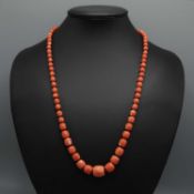 A CORAL SINGLE STRAND NECKLACE