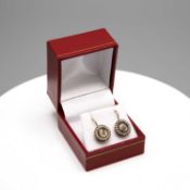 A PAIR OF VICTORIAN YELLOW METAL MOURNING EARRINGS