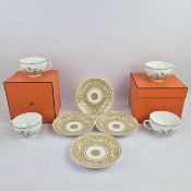 HERMES, A SET OF FOUR 'EARLY AMERICA' PATTERN TEA CUPS AND SAUCERS