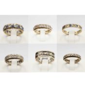 A COLLECTION OF SIX ASSORTED 9CT GOLD ETERNITY RINGS