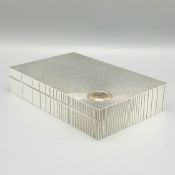 AN ART DECO STERLING SILVER CIGARETTE BOX.