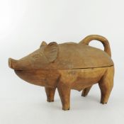 A LARGE FOLK ART CARVED WOOD PIG BOX.