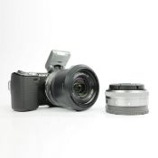 A SONY NEX-5 MIRRORLESS DIGITAL CAMERA BODY WITH A SONY E 18–55MM OSS ZOOM LENS AND SONY E 16MM F/2.
