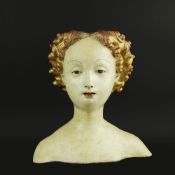 A PARCEL-GILT POLYCHROME BUST OF A LADY.