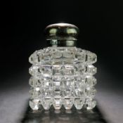 A LATE VICTORIAN MAPPIN AND WEBB CUT GLASS AND SILVER INKWELL.