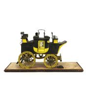 A RARE SMOKER'S COMPENDIUM IN THE FORM OF A MODEL ROAD COACH.