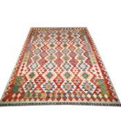 CONTEMPORARY KILIM RUG WITH ALL OVER VIBRANT GEOMETIC DESIGN.