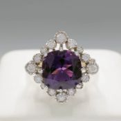 A 9CT GOLD AMETHYST AND DIAMOND CLUSTER RING.