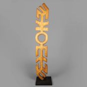 A LARGE CARVED WOOD TOTEM.