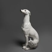 A MID 20TH CENTURY PORCELAIN GREYHOUND.