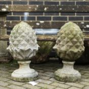 COMPOSITE STONE ACORN FINIALS, A PAIR.