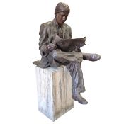 SCULPTURAL STUDY OF MAN READING NEWSPAPER.