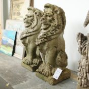SCULPTURAL SEATED LIONS, A PAIR.
