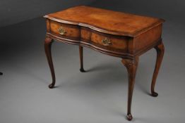 QUEEN ANNE STYLE WALNUT SERPENTINE WRITING TABLE.