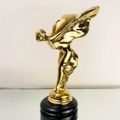 GILT METAL SPIRIT OF ECSTASY SCULPTURE ON A MARBLE BASE.