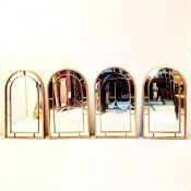 SET OF FOUR ARCHED WALL MIRRORS WITH GILT METAL FRAMES.