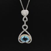 AN 18CT WHITE GOLD TOPAZ AND DIAMOND HEART PENDANT