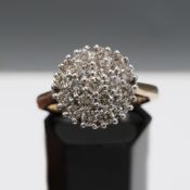 A 9CT GOLD DIAMOND CLUSTER RING