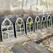 SET OF SIX ARCHITECTURAL GARDEN MIRRORS WITH ARCHED METAL FRAMES.