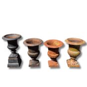 FOUR VARIOUS SMALL CAST IRON GARDEN URNS (4)