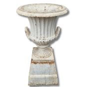 WHITE PAINTED CAST IRON GARDEN URN WITH HANDLES ON PLINTH