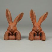 SCULPTURAL MR RABBIT HEADS, A PAIR.