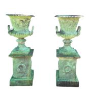 GARDEN URNS ON STANDS, A PAIR