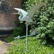 FLYING CRANE WEATHER VANE IN VERDIGRIS FINISH METAL.
