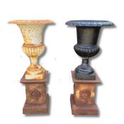 CAST IRON GARDEN URNS ON PLINTHS (2)