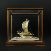 SEKI TAKEHIKO (B. 1908) A CASED SILVER SAILING BOAT