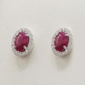 A PAIR OF 9CT GOLD RUBY STUDS