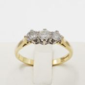 AN 18CT GOLD DIAMOND TRILOGY RING