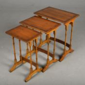 NEST OF THREE YEWWOOD TABLES (3)