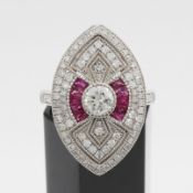A PLATINUM DIAMOND AND RUBY RING